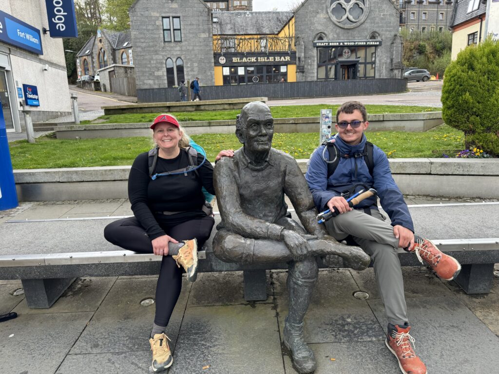 Happy hikers at the end of the West Highland Way